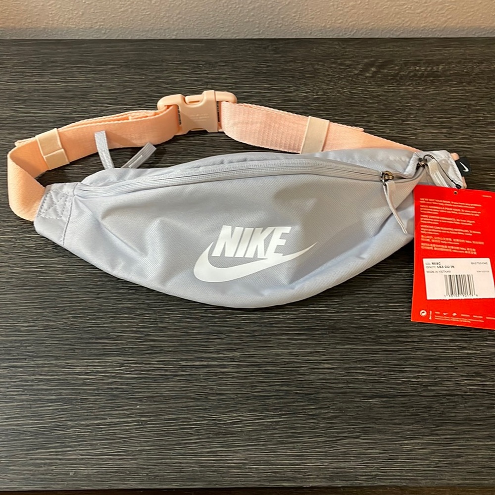 Pastel blue Nike waist pack w/ 3 zipper compartments. Peach adjustable strap